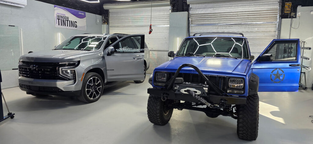 Two trucks in the Tint Chattanooga install bays