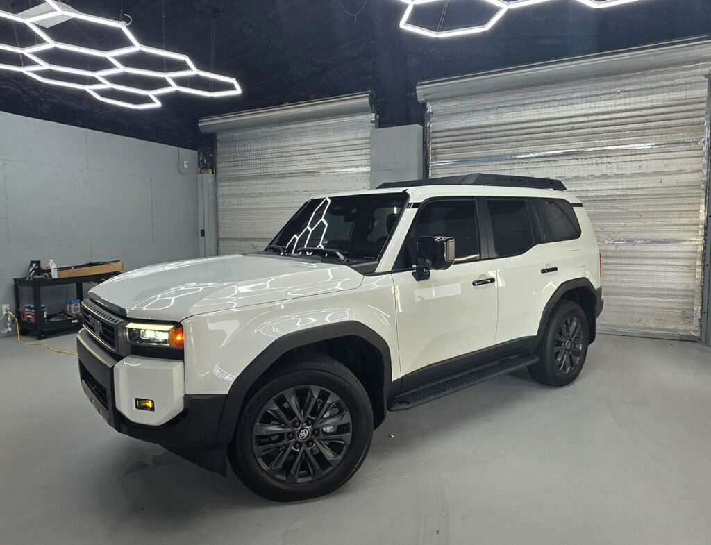 Tinted SUV under studio lights