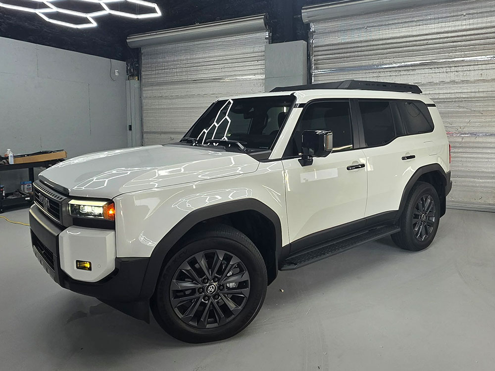 Tinted SUV, front three-quarter view