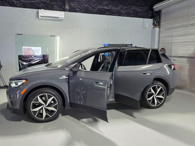 SUV with doors open for a final inspection in the studio