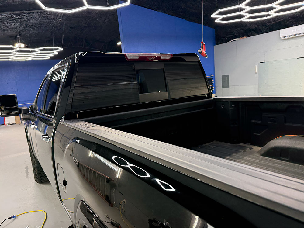 Black truck with tinted rear glass
