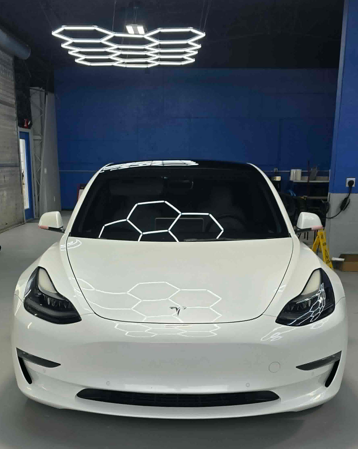 White Tesla with Llumar window film in the studio