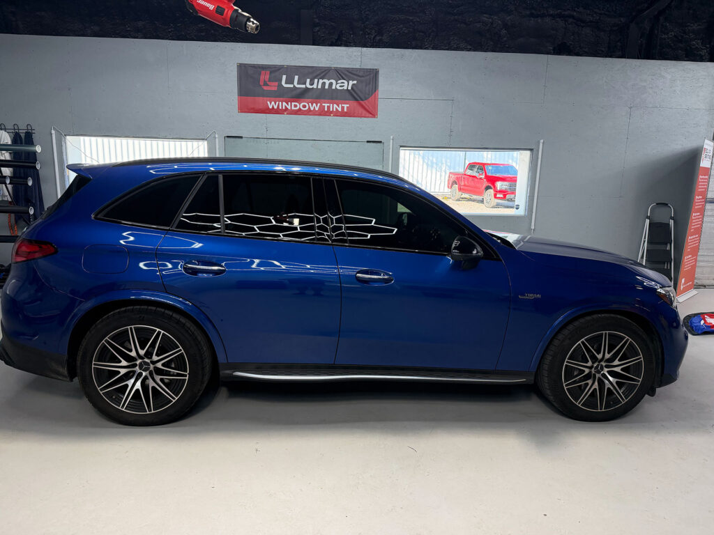 Blue SUV with fresh window tint in the Tint Chattanooga studio